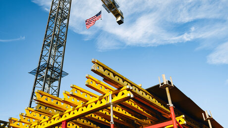 Mazza Galleria project site tower crane with American flag flying