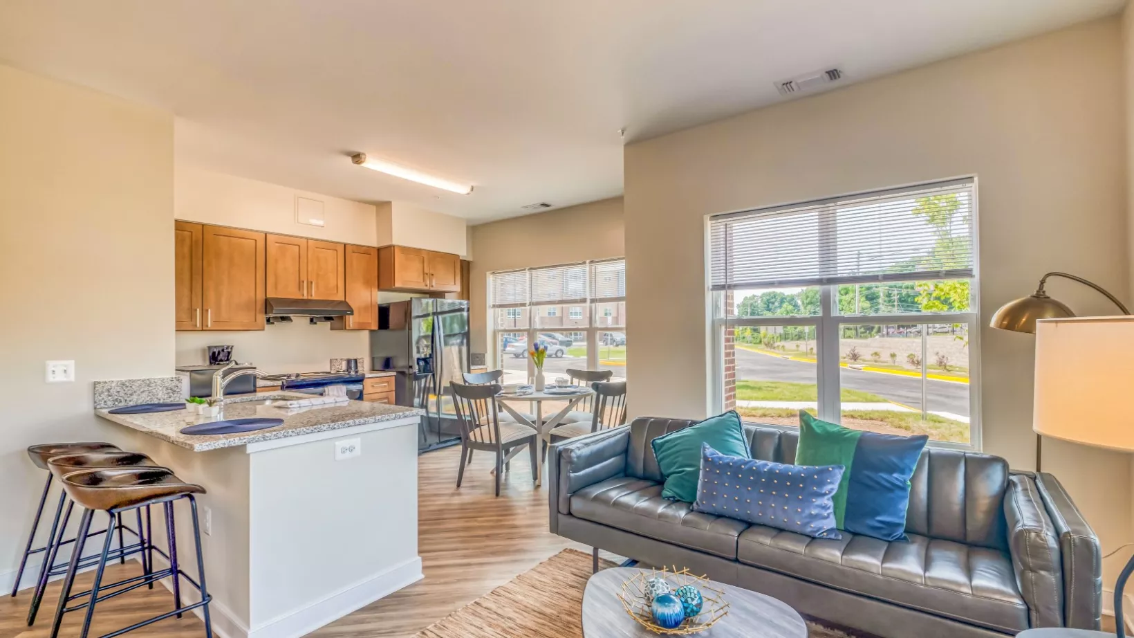 A modern, luxurious looking apartment with appliances and furniture.