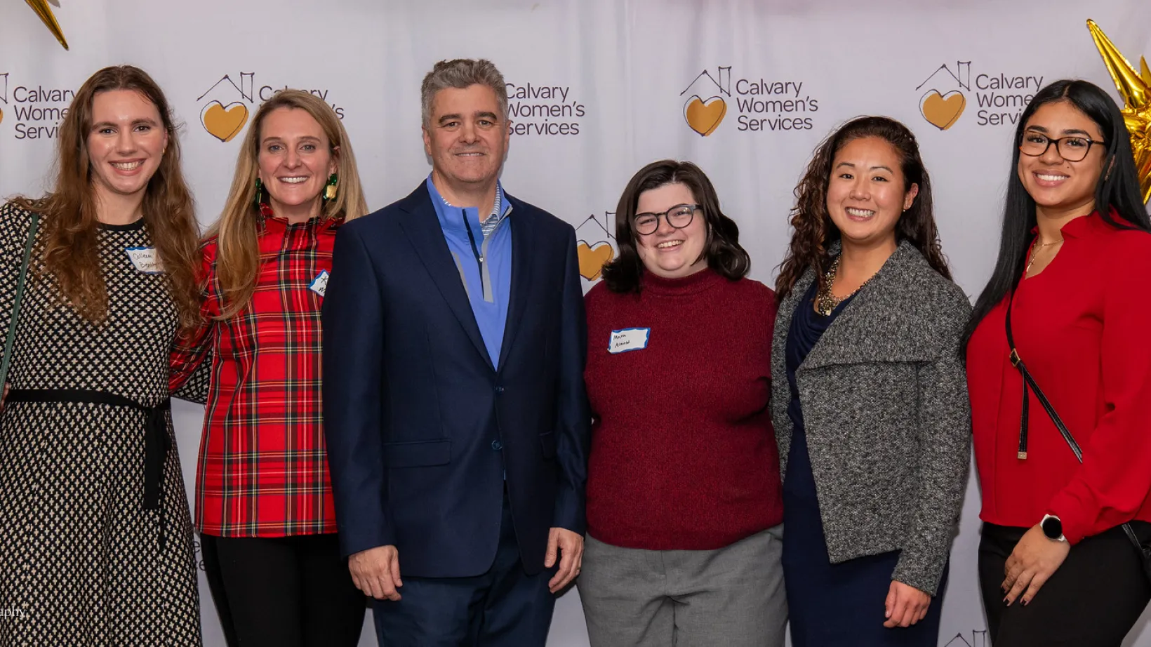 Group of people stands together at a community outreach event