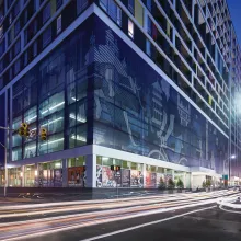 Exterior shot of an apartment building at night.