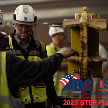 Two men in construction gear look at each other. The logo for ABC's STEP Safety program, which acknowledges DAVIS has reached platinum level, is in the corner.