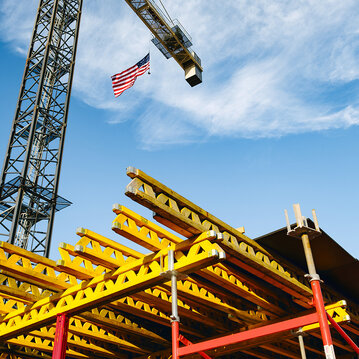 Mazza Galleria project site tower crane with American flag flying