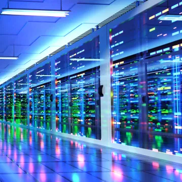Data center room with multiple rows of server racks
