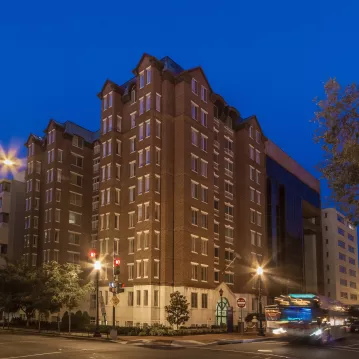 Exterior shot of an dormitory at night.