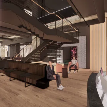 Interior of a fitness studio with couches and a staircase