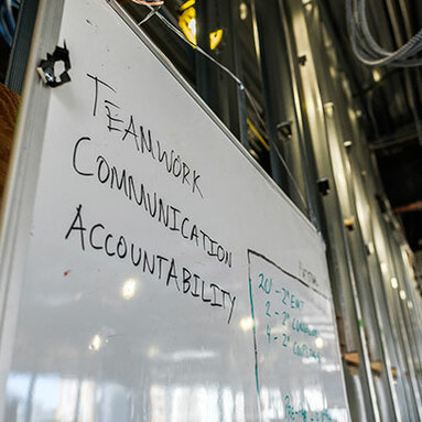 Teamwork Communication Accountability written on a white board 