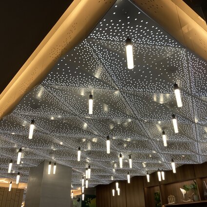 Custom ceiling lights in ground floor main lobby