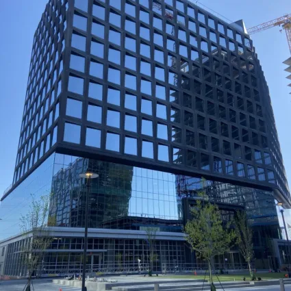 Exterior shot of an apartment building in the day.