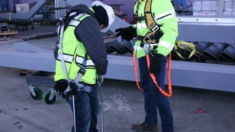 construction workers performing safety check