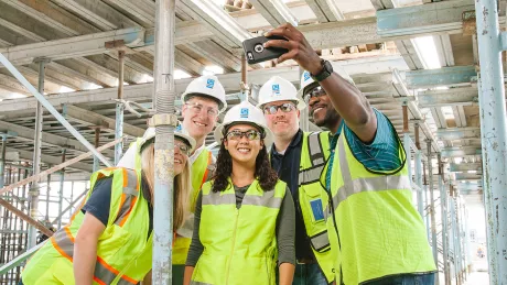 team taking photo on-site