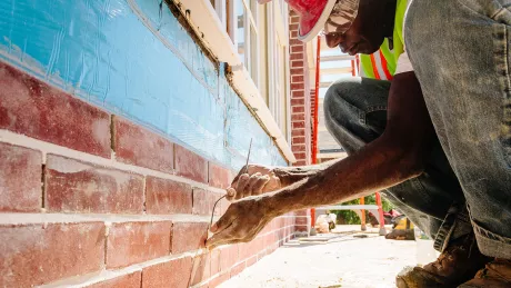 trade partner working on brick facade