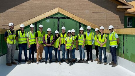 Project team poses for a photo at the topping out celebration