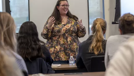 Project Manager Kayla Bonish speaks to an audience about women in construction.