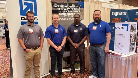 DAVIS team poses at a college recruiting event.
