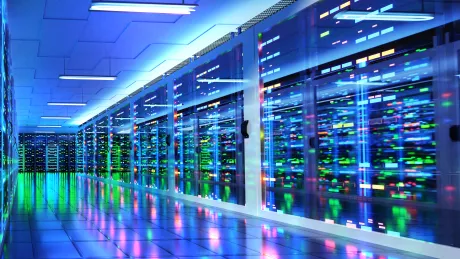 Data center room with multiple rows of server racks