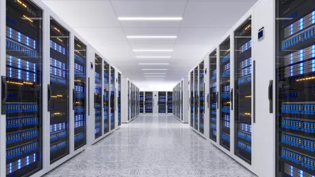 Data center room with multiple rows of server racks