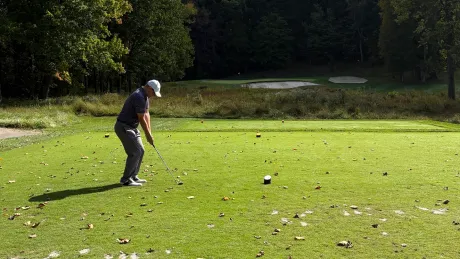A man golfing