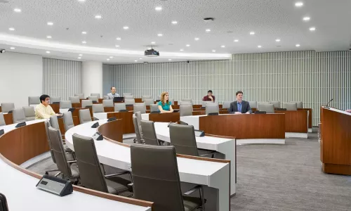 lecture hall with tables in crescent shape
