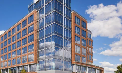 Corner view of brick and glass building