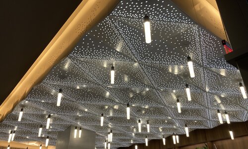Custom ceiling lights in ground floor main lobby