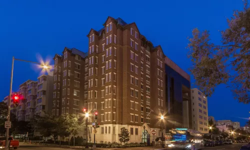Exterior shot of an dormitory at night.
