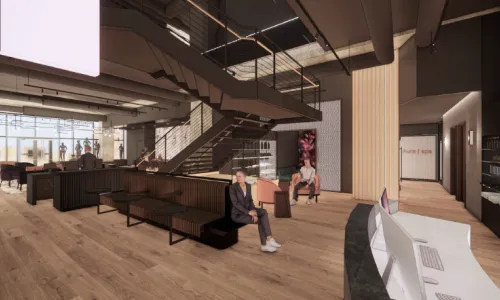 Interior of a fitness studio with couches and a staircase