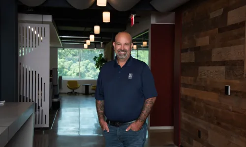 A man stands in a hallway