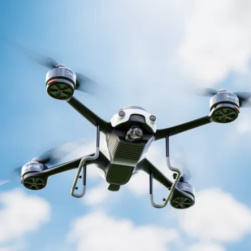A drone flies in the sky