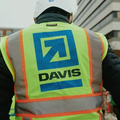 a construction worker with a DAVIS logo on his safety vest