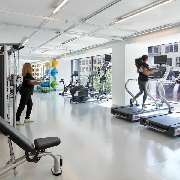 A fitness center with treadmills and machines.