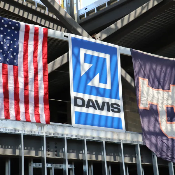 The Potomac School flag hanging next to the American flag and the DAVIS logo