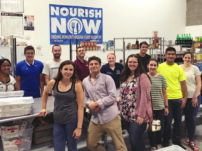 people posing for camera at Nourish Now site