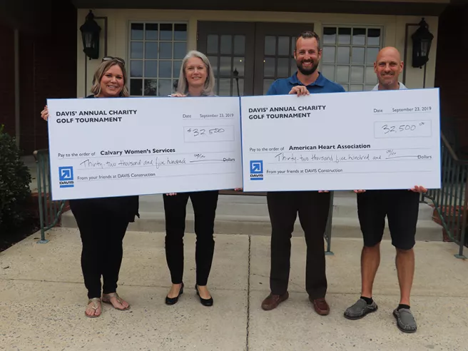 Calvary Women's Services + American Heart Association receiving check at DAVIS' annual charity golf tournament